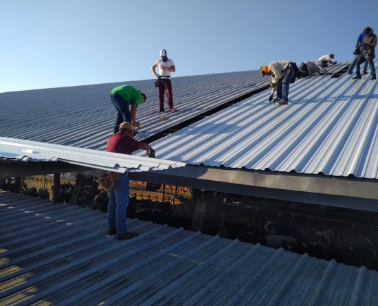 Choice One Restoration team on commercial roof